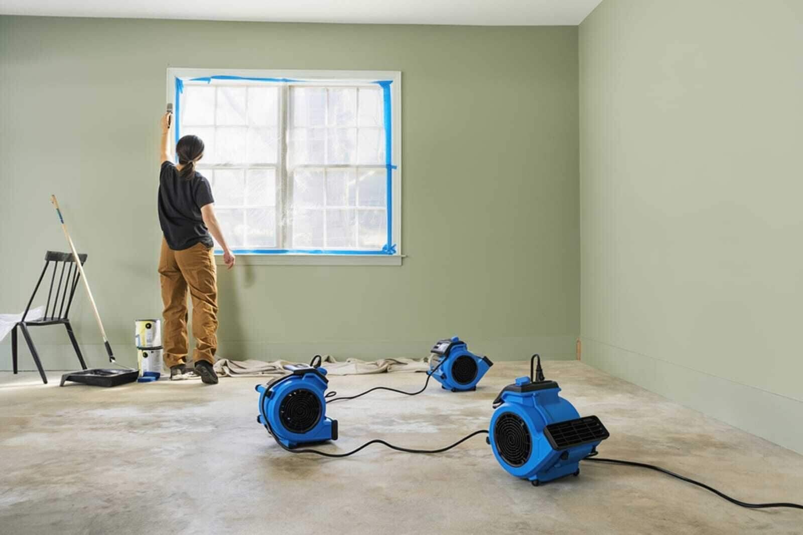 Professional water damage restoration crew with equipment